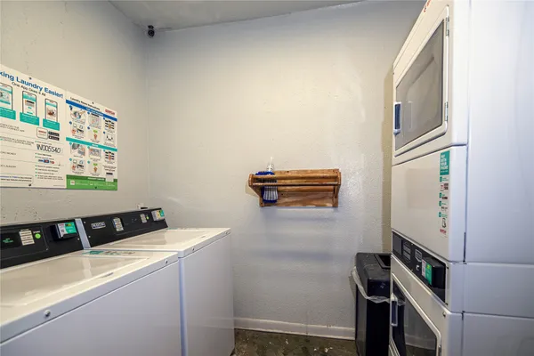 a view of house with outdoor space and swimming pool