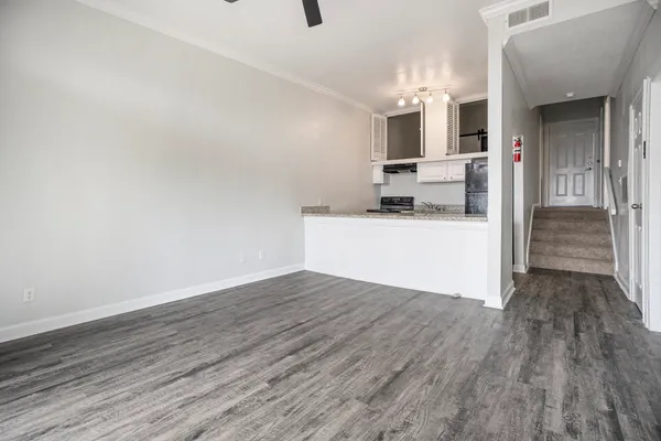 a view of a kitchen from the hallway