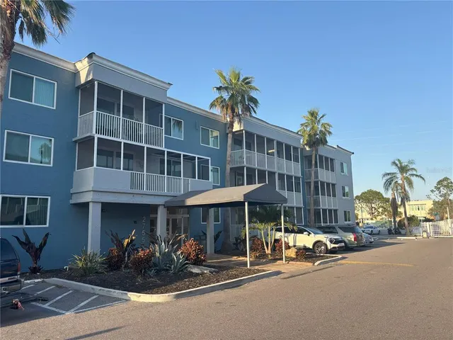 a group of cars parked in front of a building