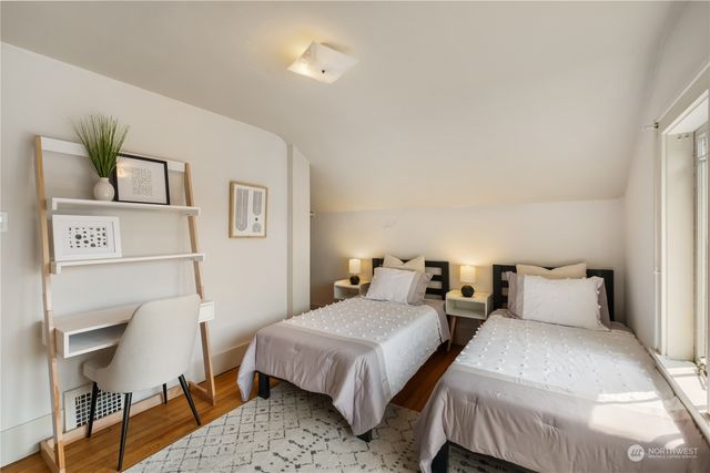 a bedroom with a bed and chair