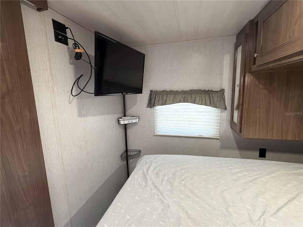 3000 Clarcona Road, Unit 743 Apopka, FL 32703 - Photo 38 of 54 a bedroom with a bed and a window