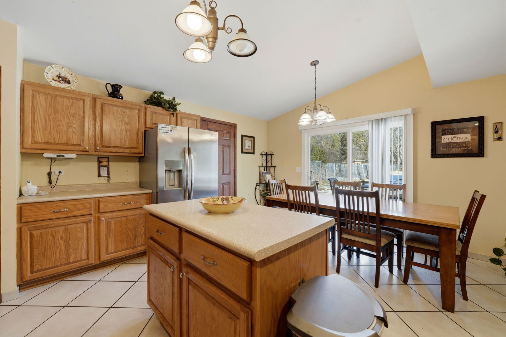 1317 North Cedar Lake Road Lake Villa, IL 60046 - Photo 11 of 25 a kitchen that has a cabinets counter space dining table and a sink