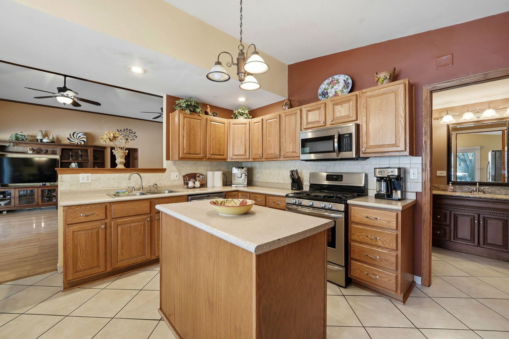 1317 North Cedar Lake Road Lake Villa, IL 60046 - Photo 14 of 25 a kitchen with a stove a sink and a microwave