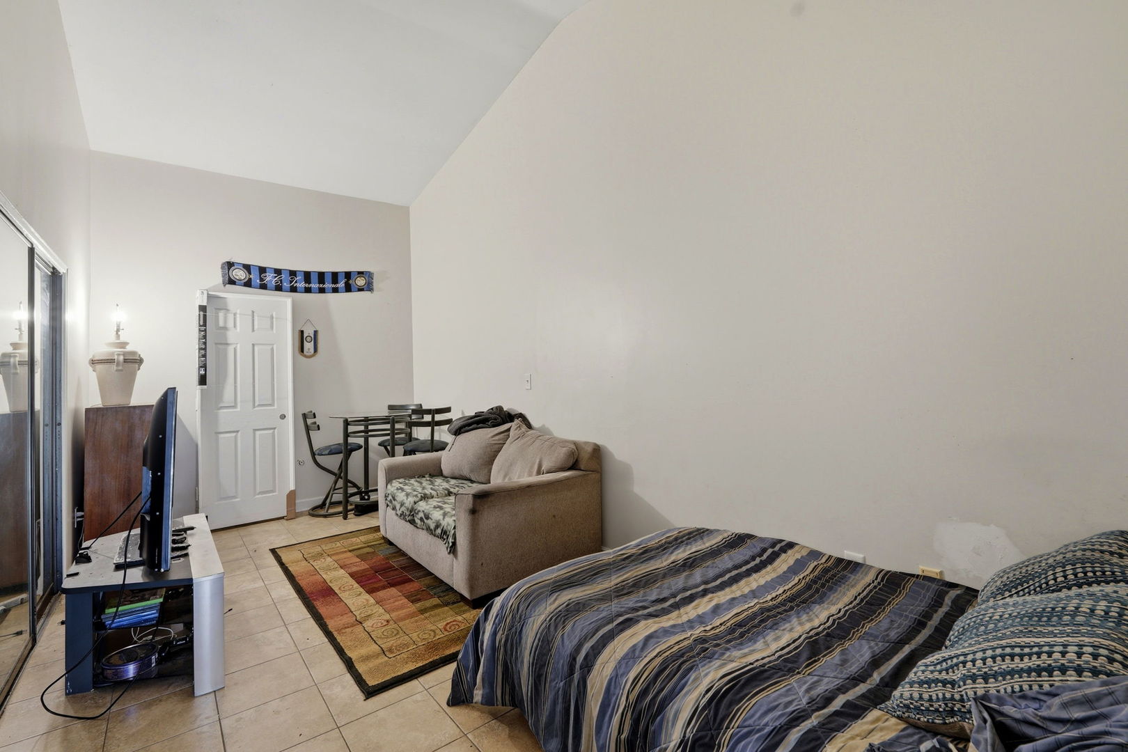 1317 North Cedar Lake Road Lake Villa, IL 60046 - Photo 19 of 25 a bedroom with two beds and a flat screen tv