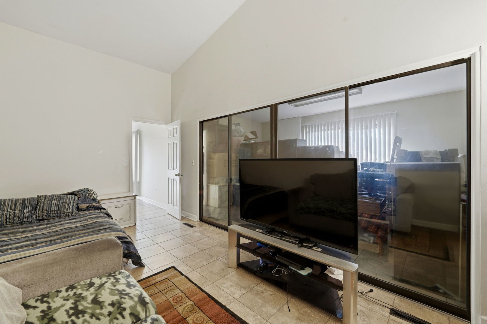 1317 North Cedar Lake Road Lake Villa, IL 60046 - Photo 20 of 25 a living room with a flat screen tv and a fireplace