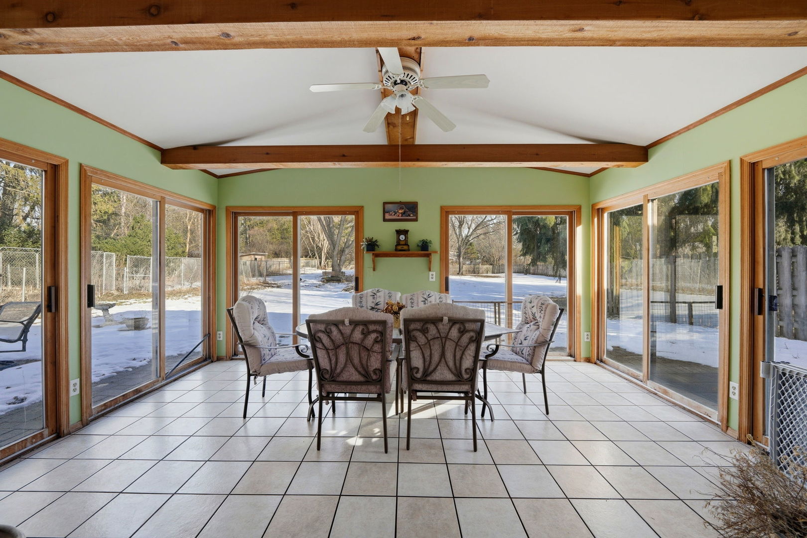 1317 North Cedar Lake Road Lake Villa, IL 60046 - Photo 6 of 25 a view of a dining room with furniture wooden floor and chandelier