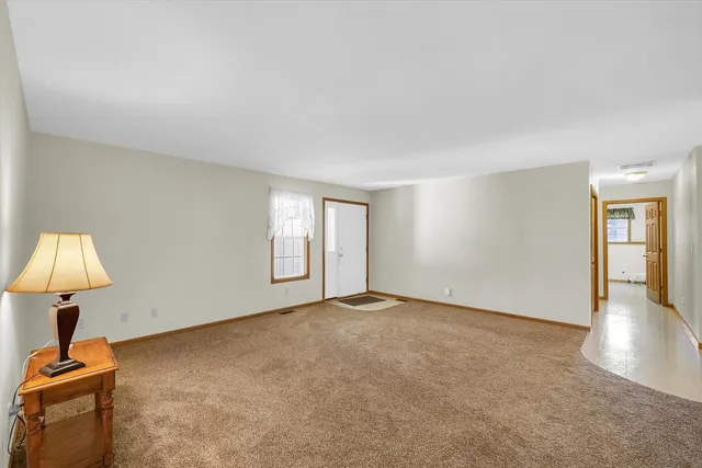 a kitchen that has a lot of cabinets in it and wooden cabinets