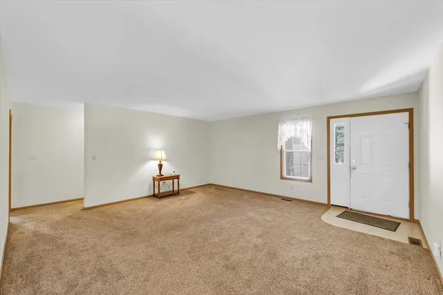 a kitchen with stainless steel appliances a sink a stove cabinets counter space and a window