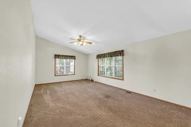 a kitchen with a refrigerator a stove top oven a sink and cabinets