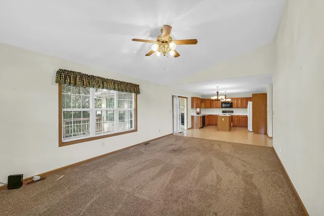 a kitchen with a sink a stove and cabinets
