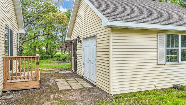 a view of a lake with a house in the background