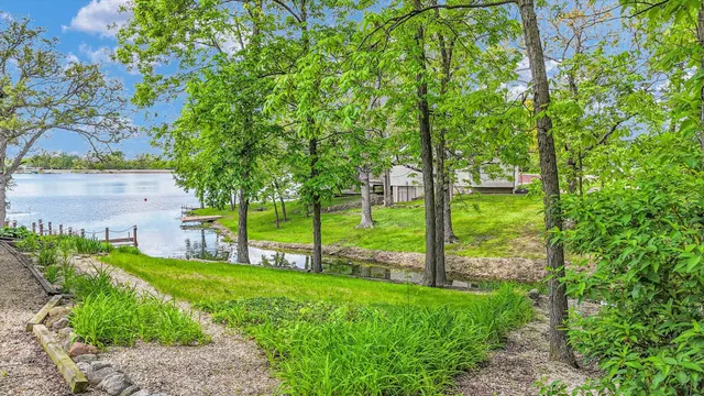 a view of a house with a yard and plants