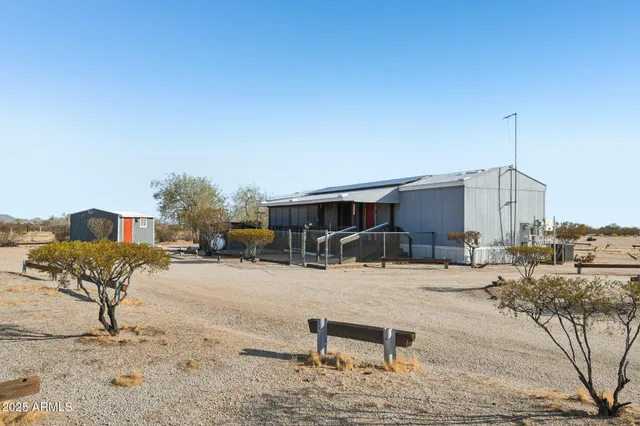 a view of a backyard with sitting area