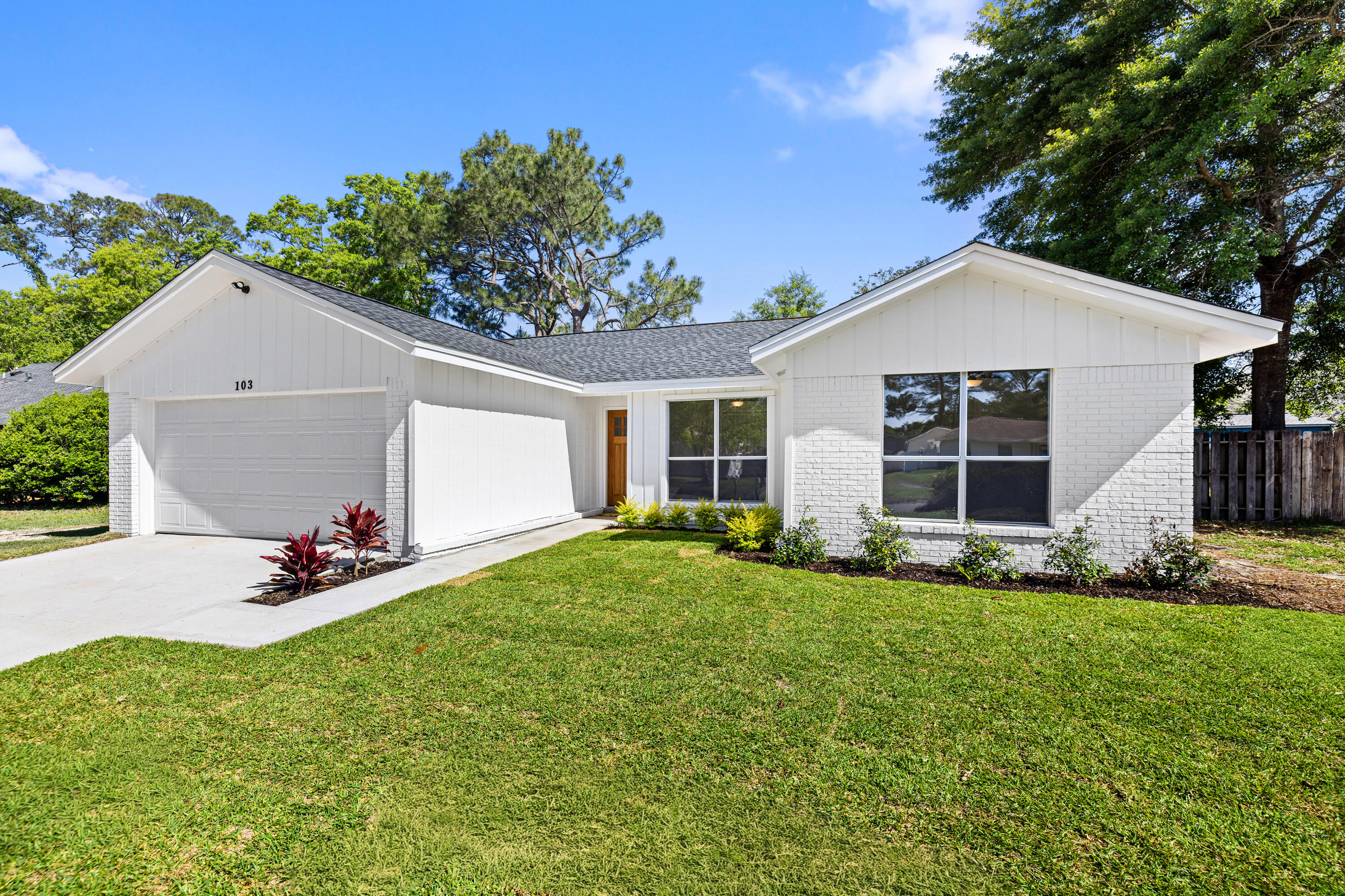 103 Perdido Circle Niceville, FL 32578 - Photo 1 of 71 a front view of a house with a yard