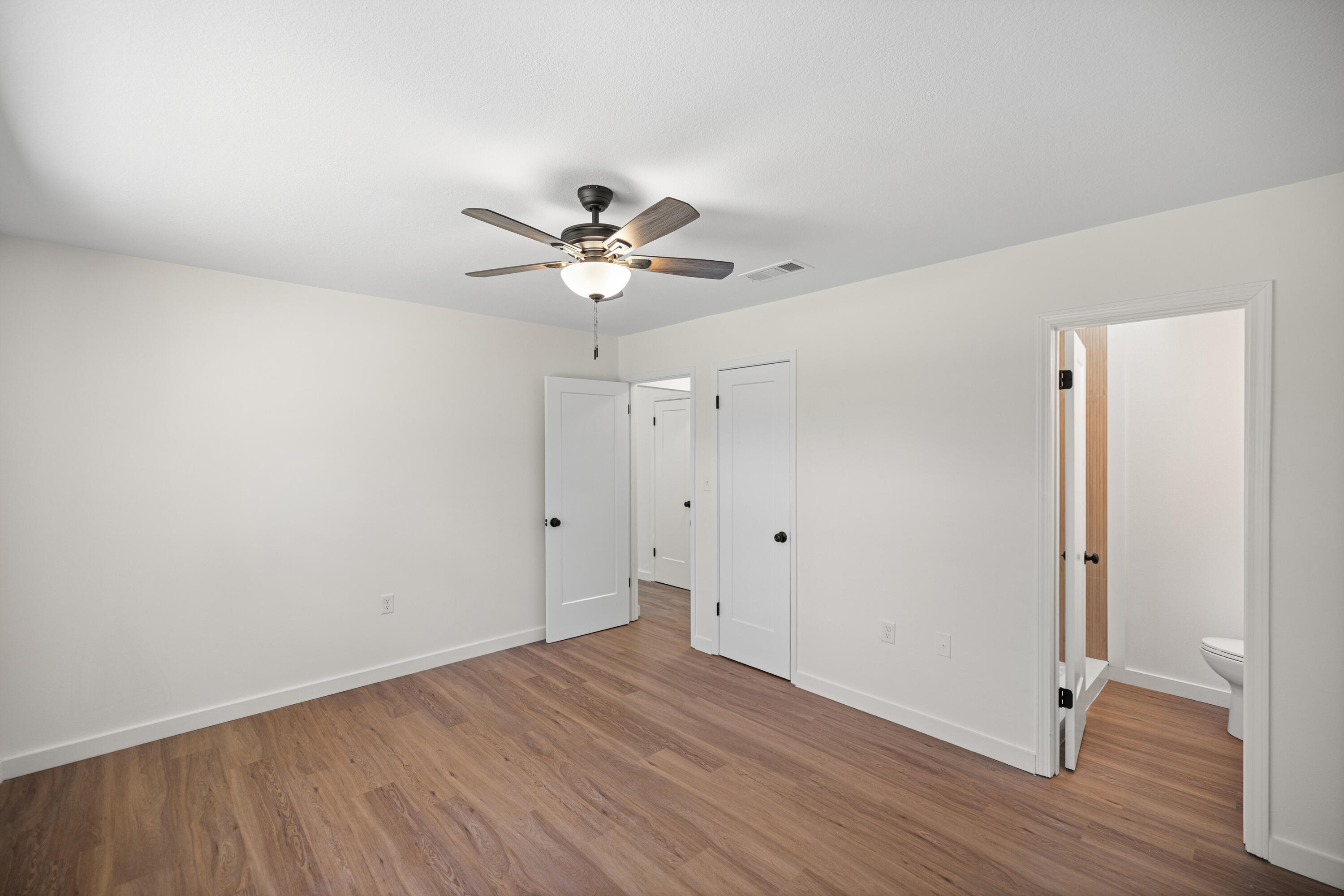 103 Perdido Circle Niceville, FL 32578 - Photo 13 of 71 a view of an empty room with wooden floor