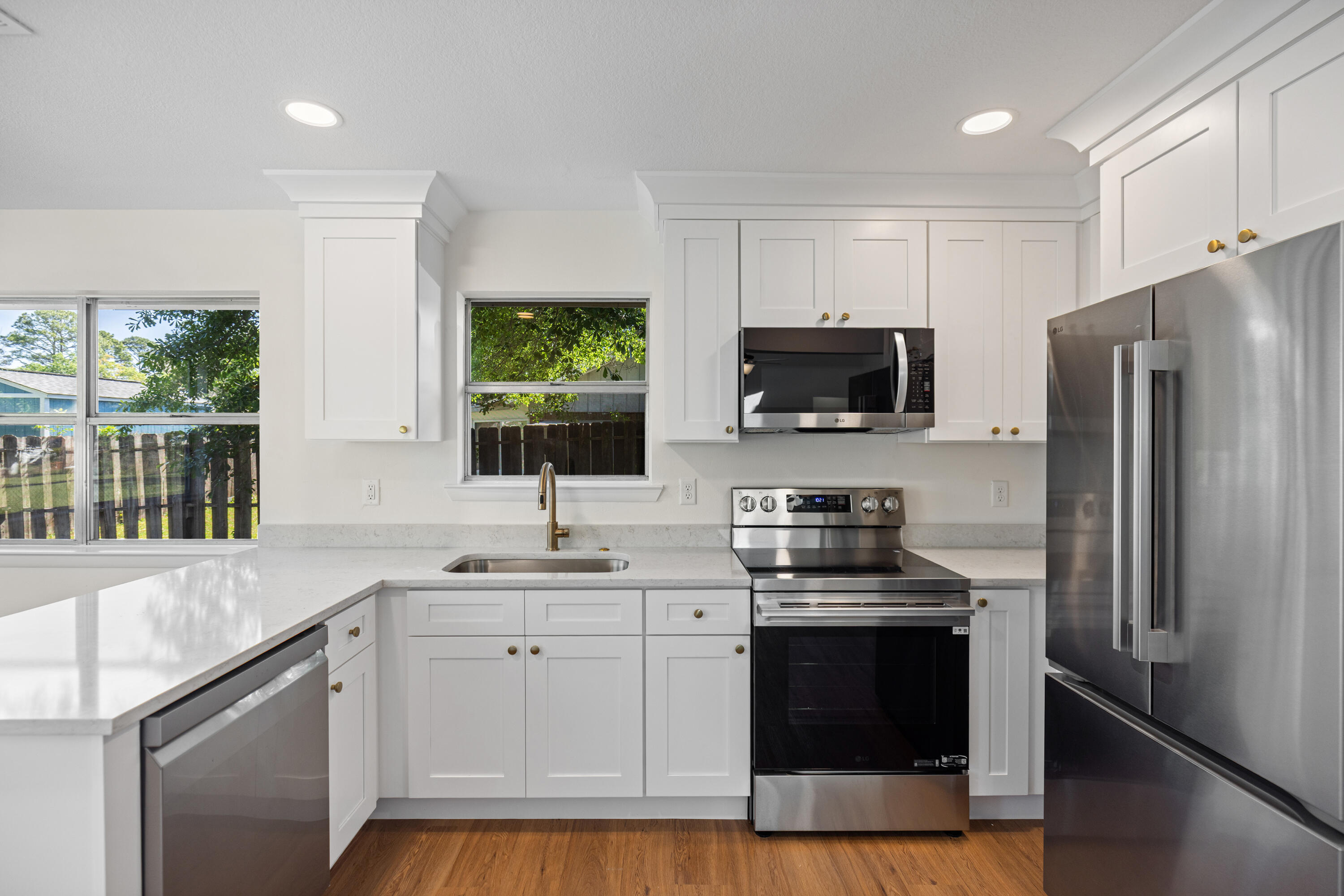 103 Perdido Circle Niceville, FL 32578 - Photo 20 of 71 a kitchen with a sink stove and microwave