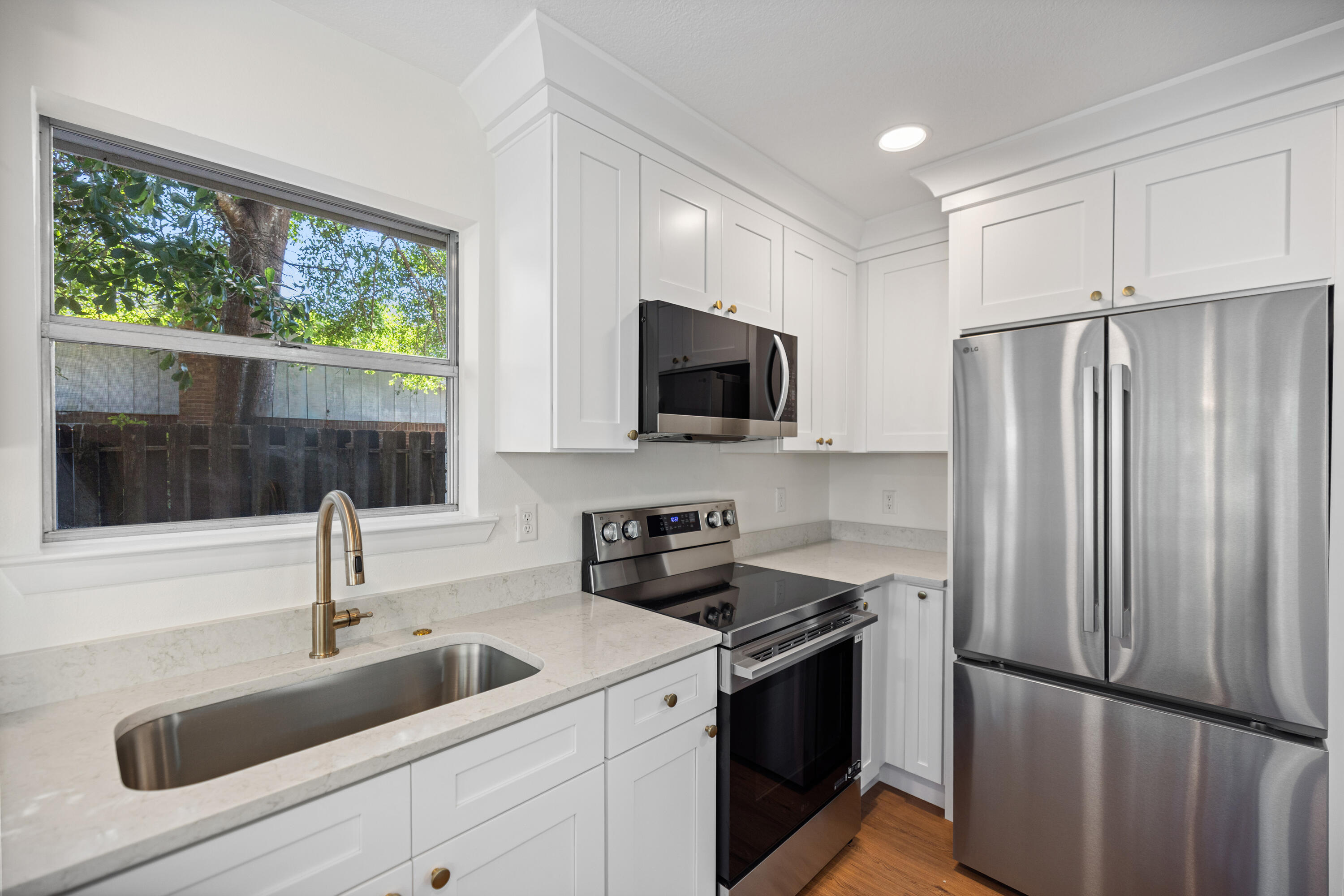 103 Perdido Circle Niceville, FL 32578 - Photo 22 of 71 a kitchen with a sink appliances and cabinets