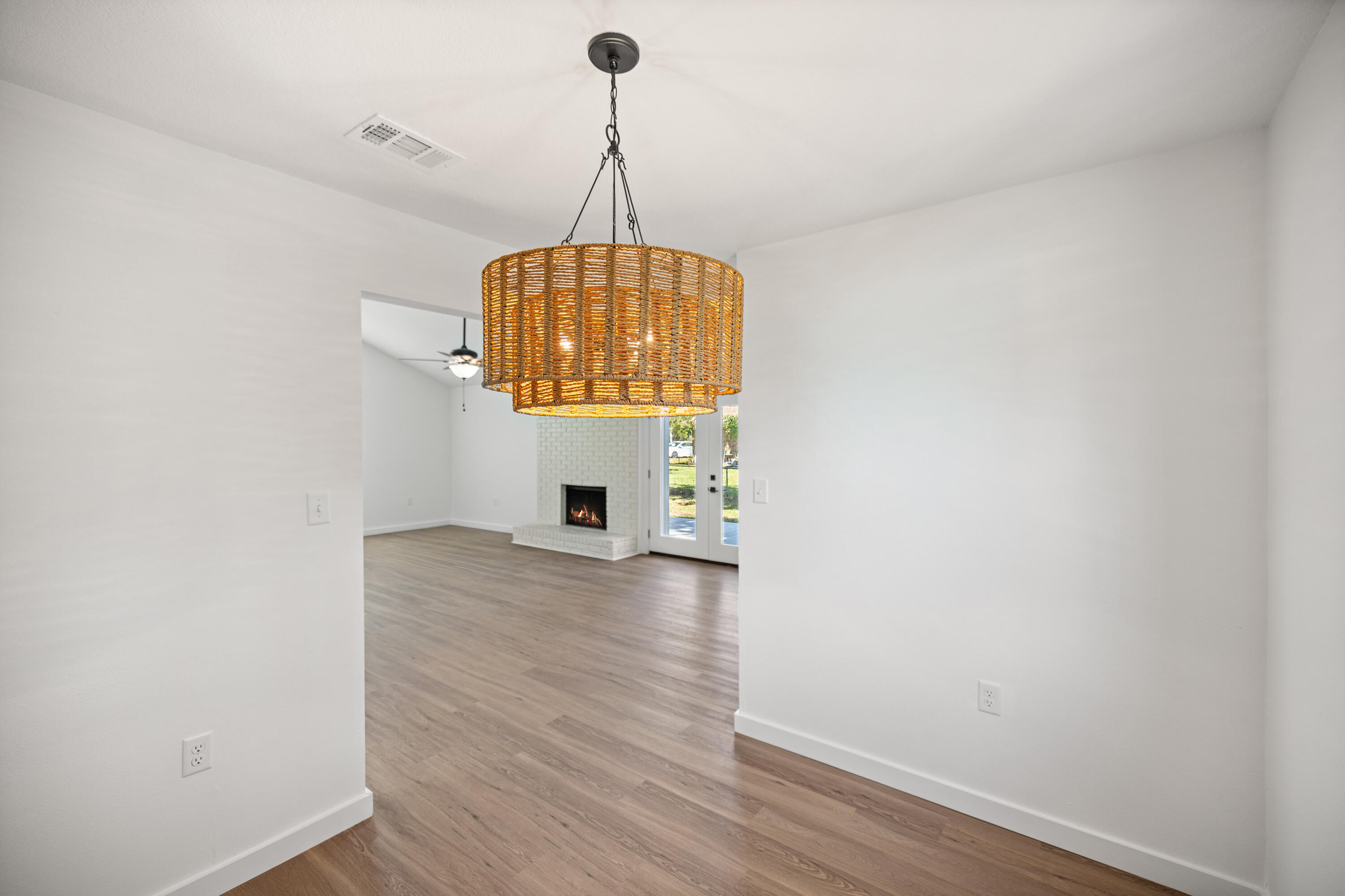 103 Perdido Circle Niceville, FL 32578 - Photo 37 of 71 a view of room with wooden floor chandelier and window