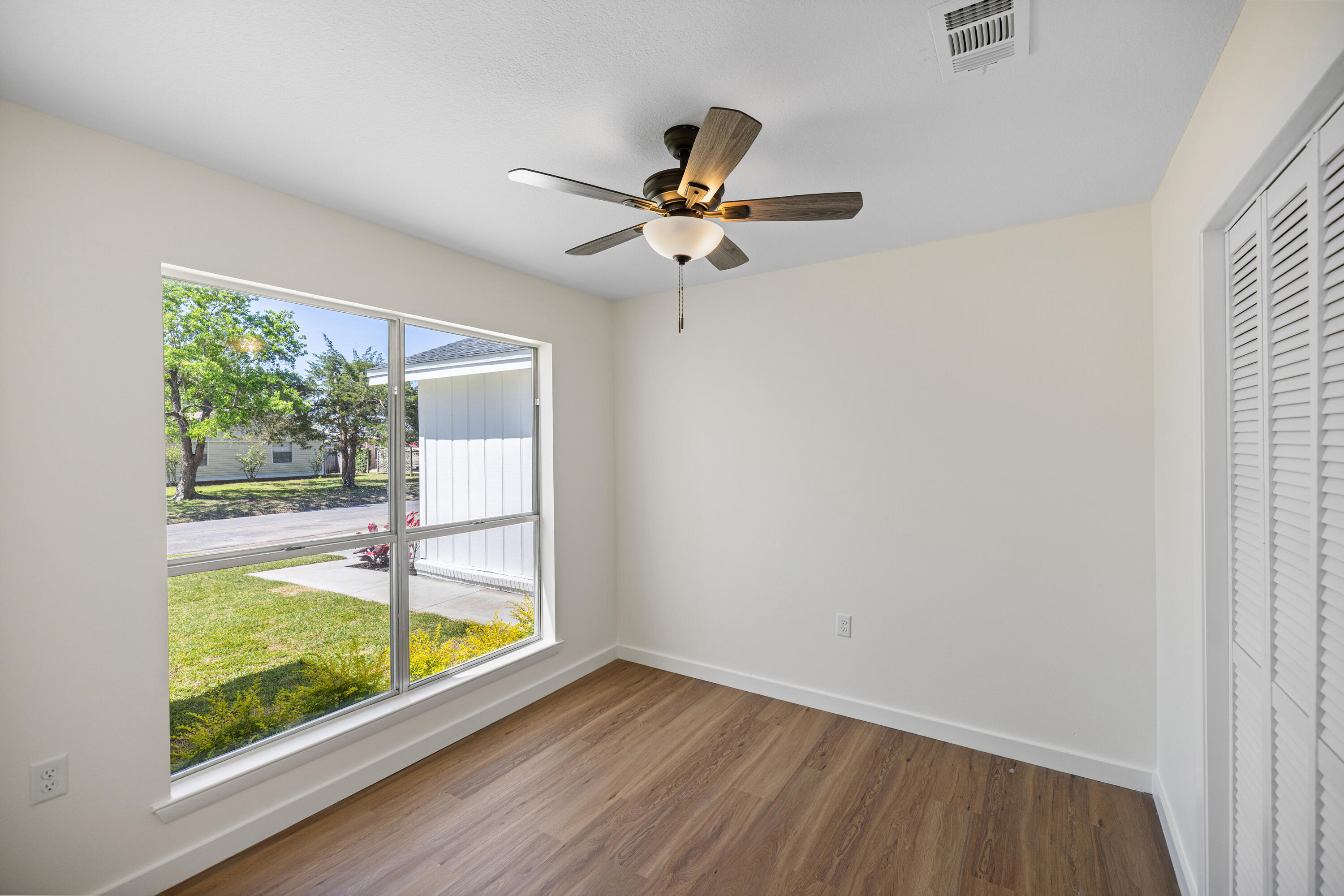 103 Perdido Circle Niceville, FL 32578 - Photo 41 of 71 wooden floor in an empty room with a window