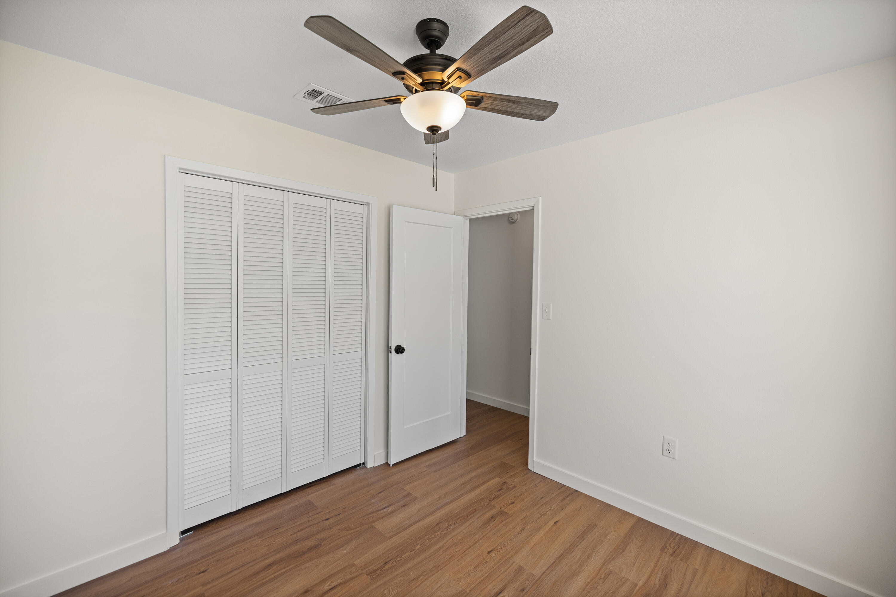 103 Perdido Circle Niceville, FL 32578 - Photo 42 of 71 a view of an empty room with wooden floor