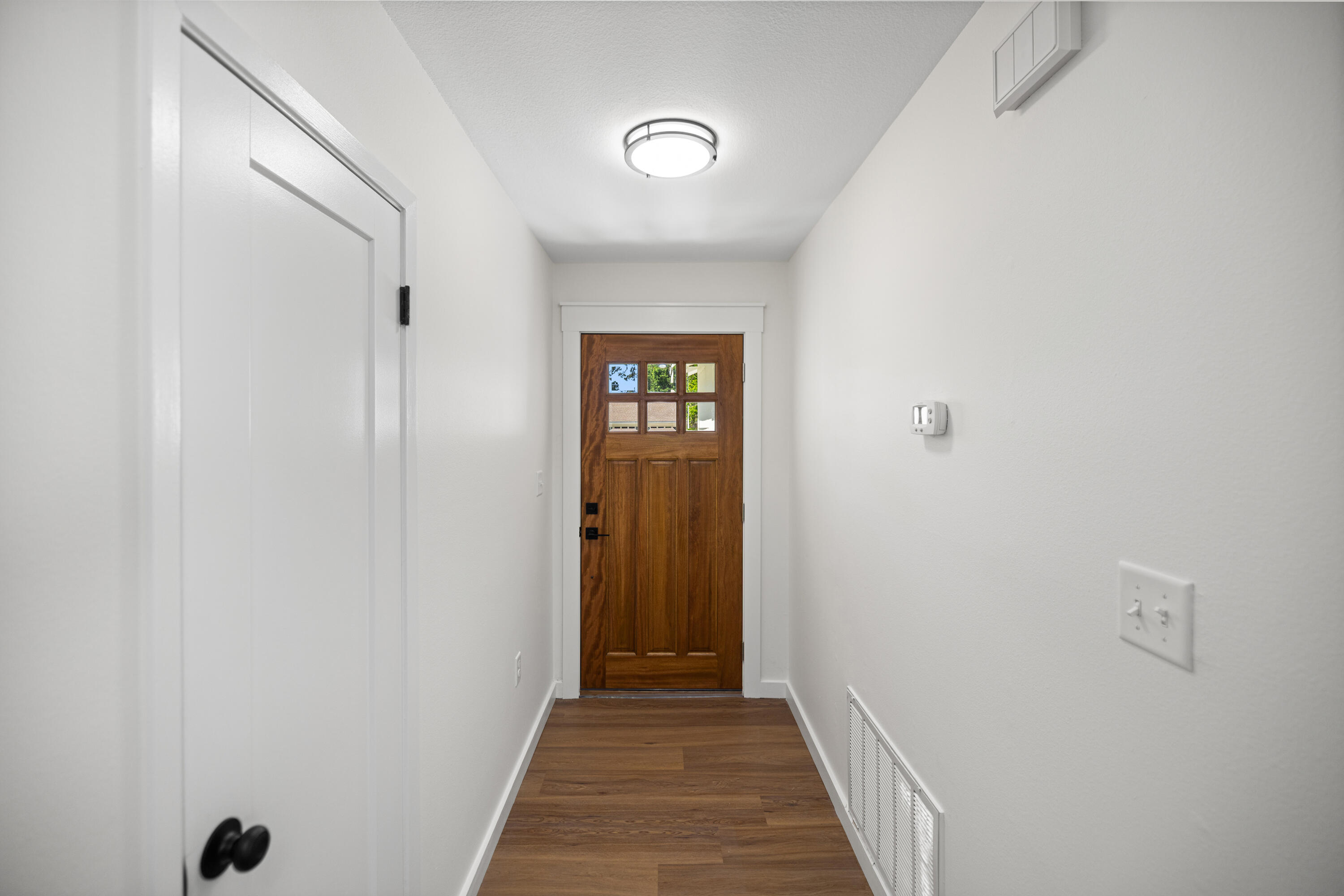 103 Perdido Circle Niceville, FL 32578 - Photo 5 of 71 a view of a hallway with wooden floor and closet