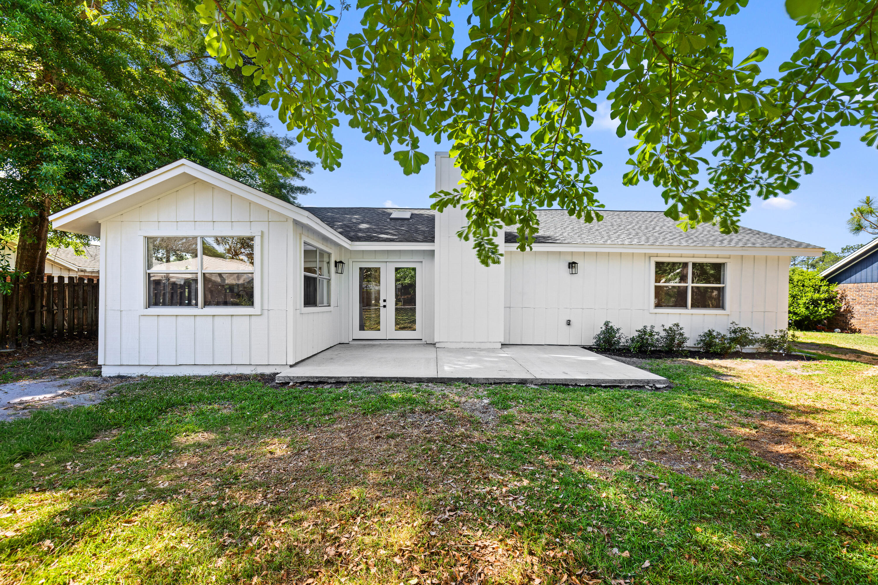 103 Perdido Circle Niceville, FL 32578 - Photo 50 of 71 a front view of a house with a yard and garage