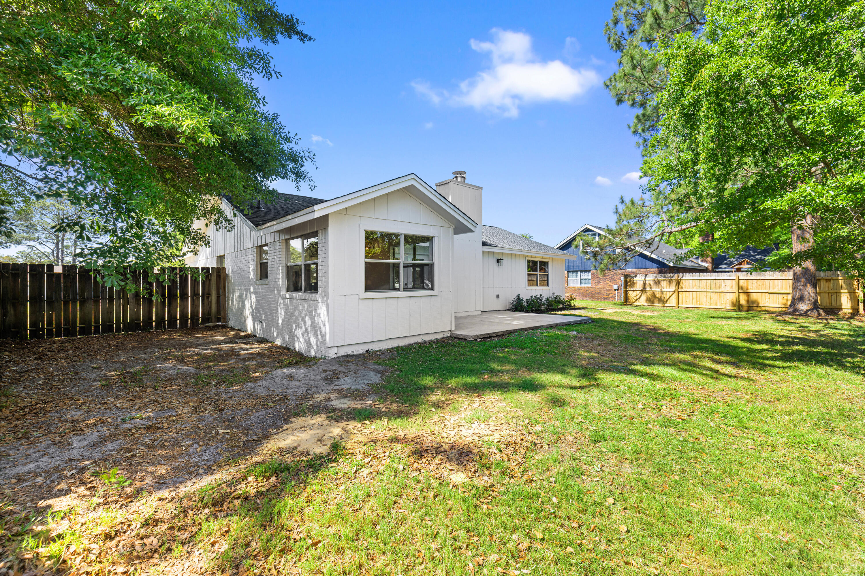 103 Perdido Circle Niceville, FL 32578 - Photo 53 of 71 a view of a house with backyard and a tree