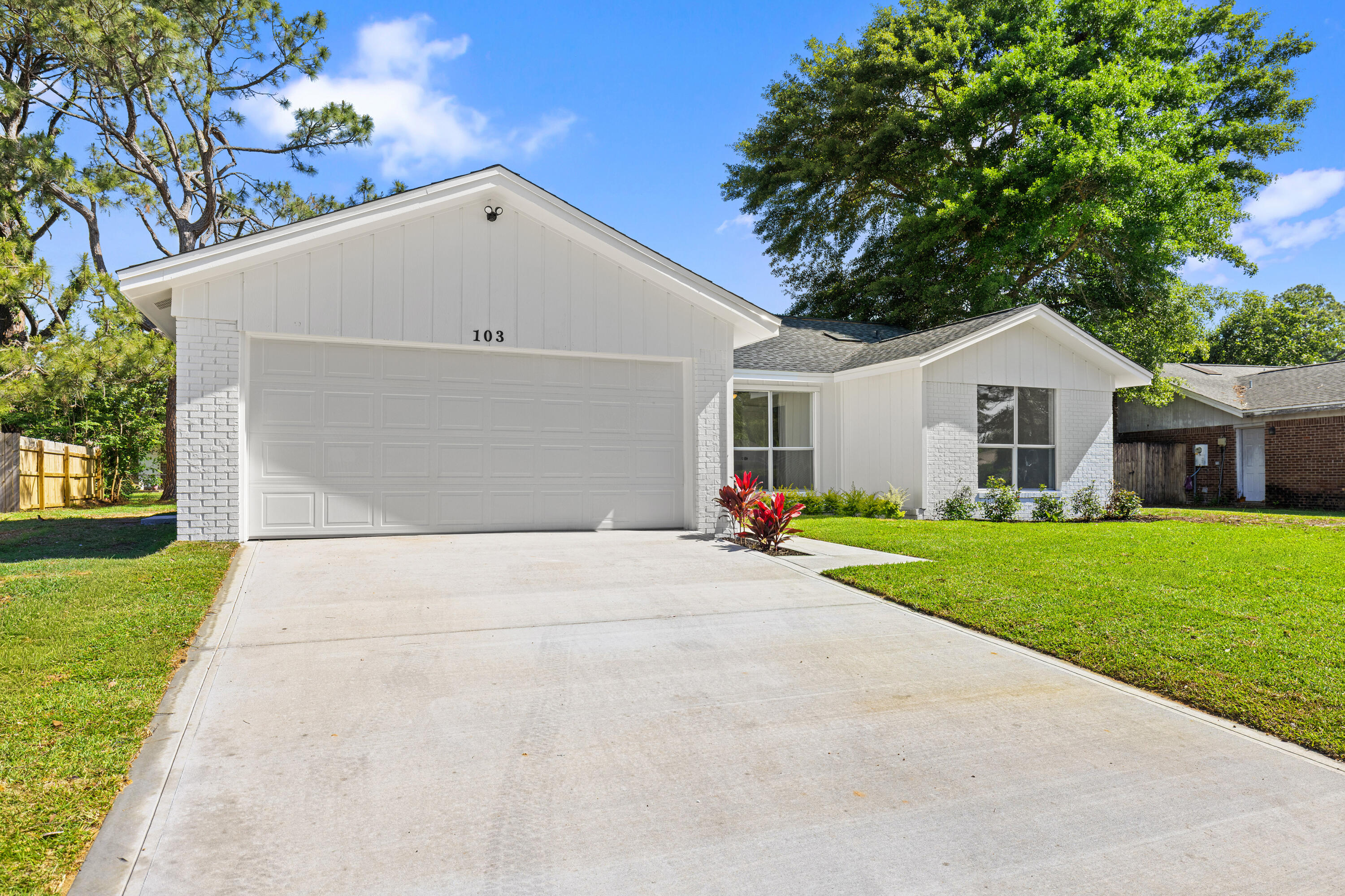 103 Perdido Circle Niceville, FL 32578 - Photo 62 of 71 a front view of house with yard and green space