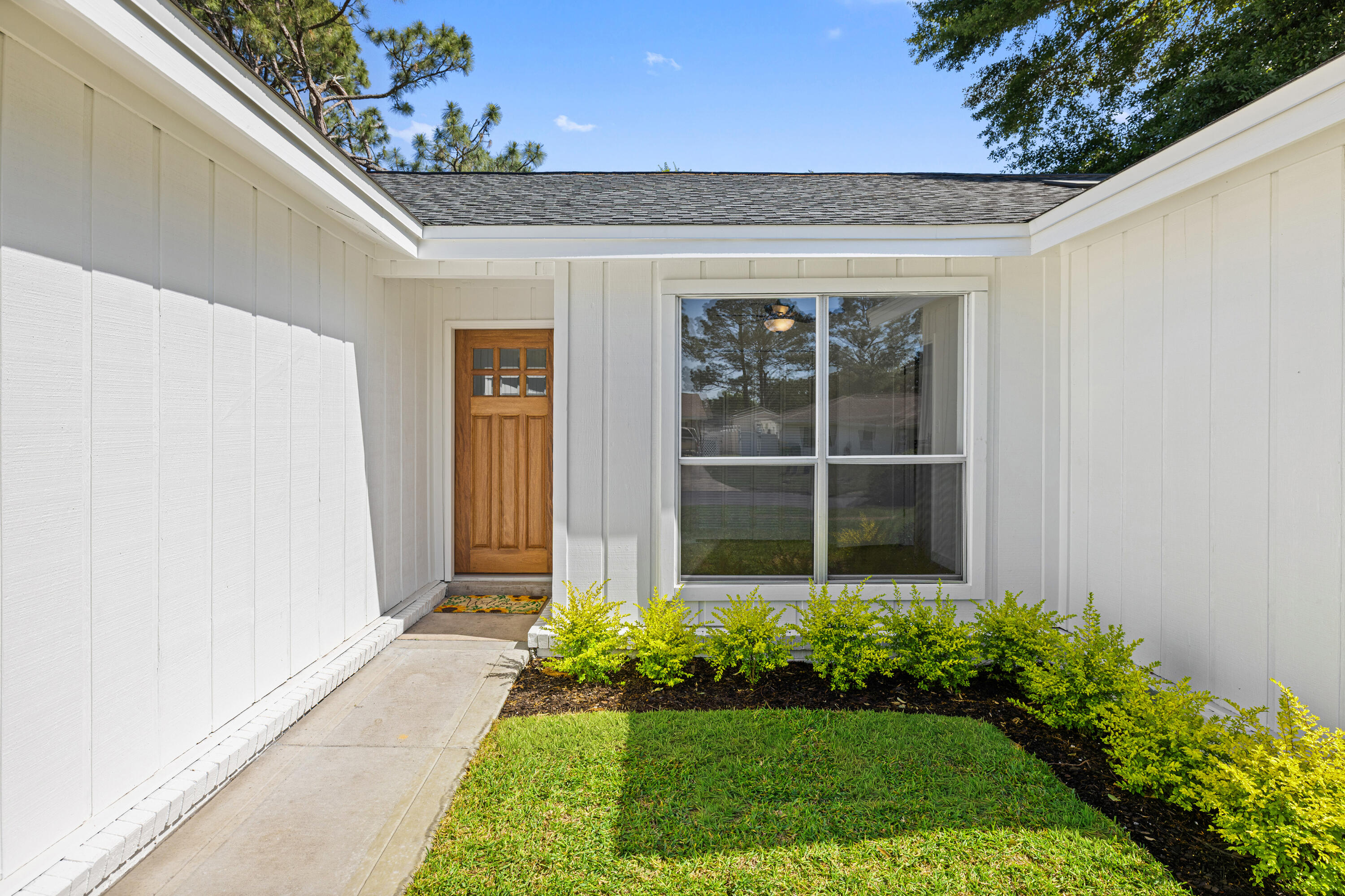 103 Perdido Circle Niceville, FL 32578 - Photo 64 of 71 a front view of a house with a yard