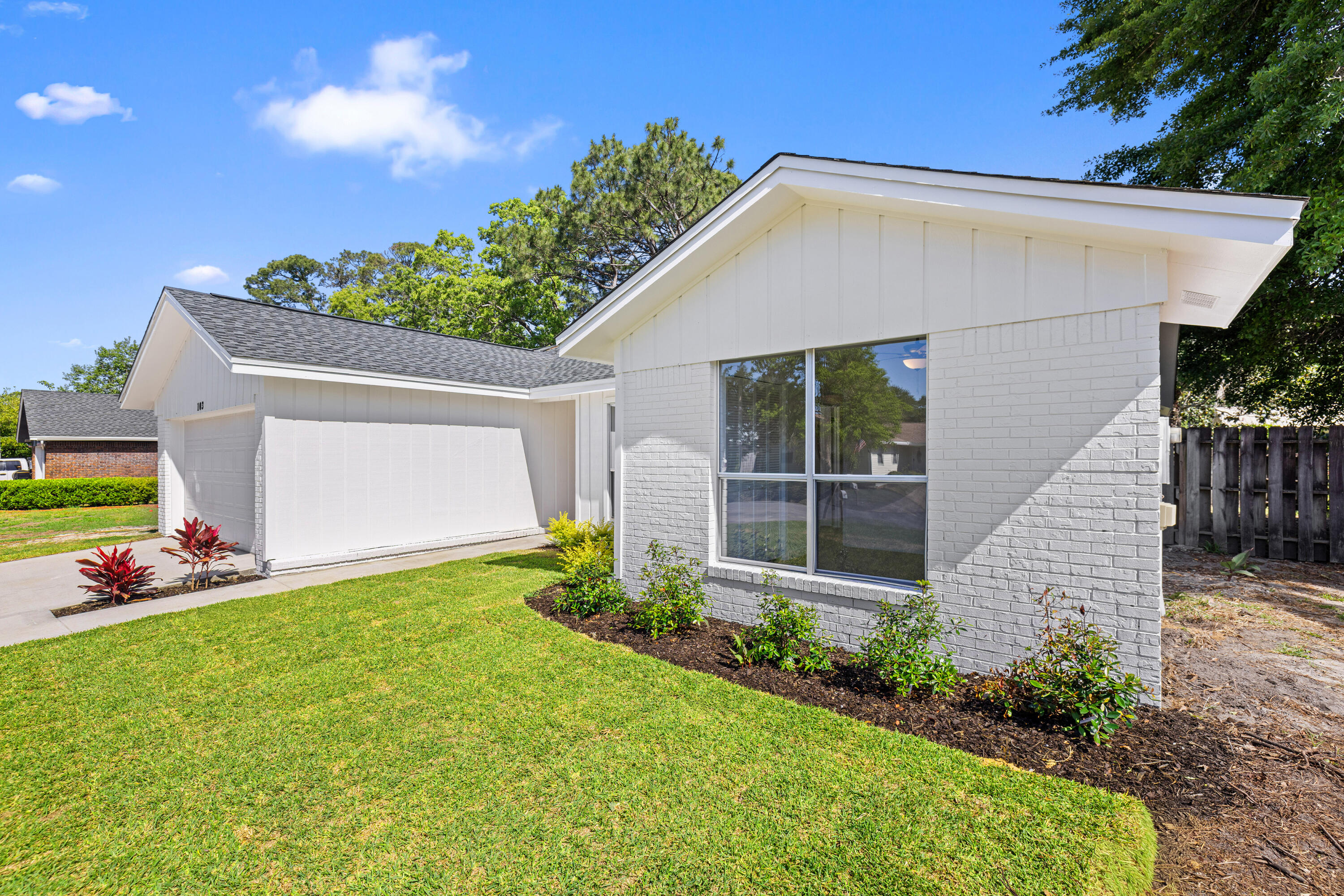 103 Perdido Circle Niceville, FL 32578 - Photo 65 of 71 a view of a house with backyard and garden