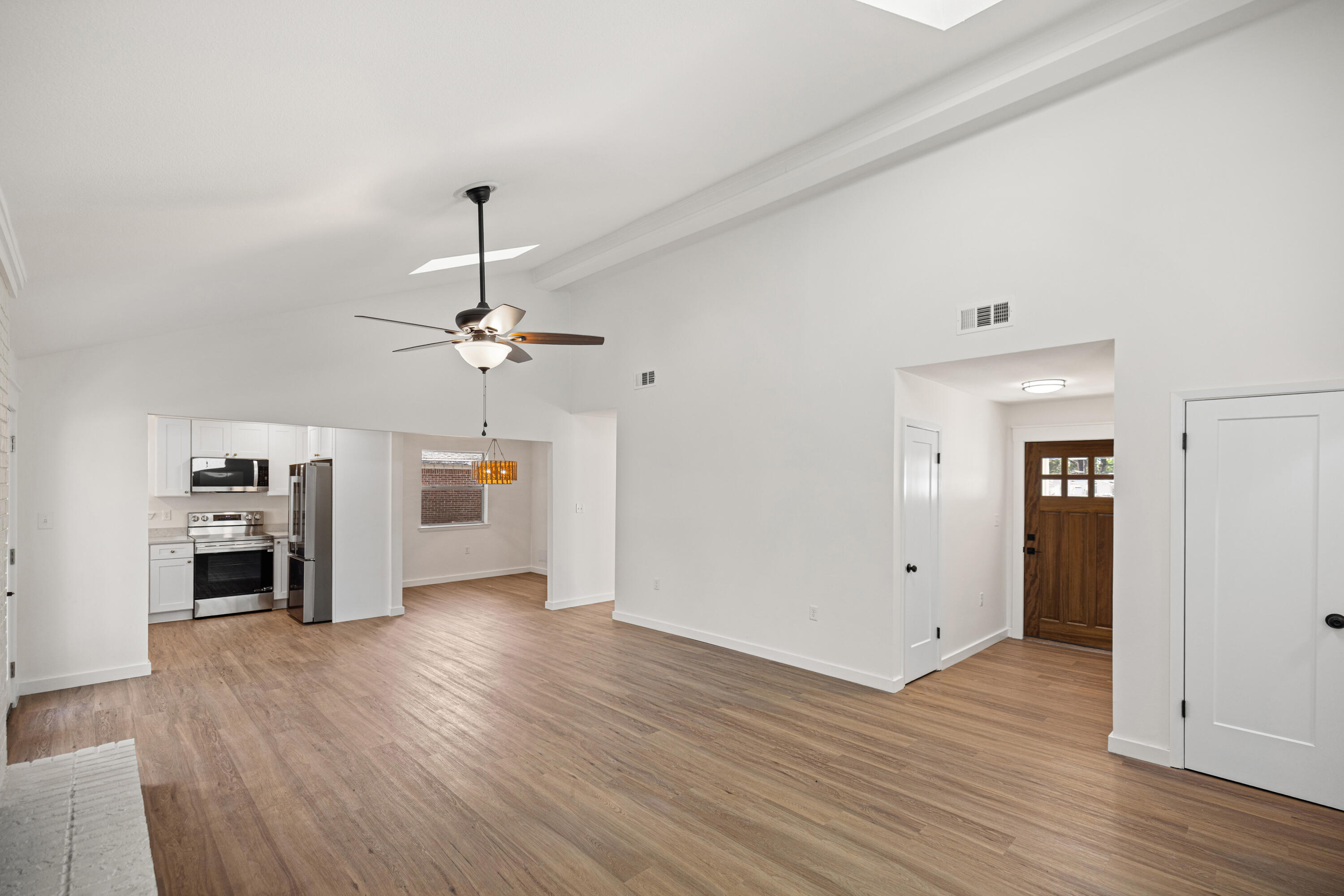 103 Perdido Circle Niceville, FL 32578 - Photo 7 of 71 wooden floor in an empty room with a window