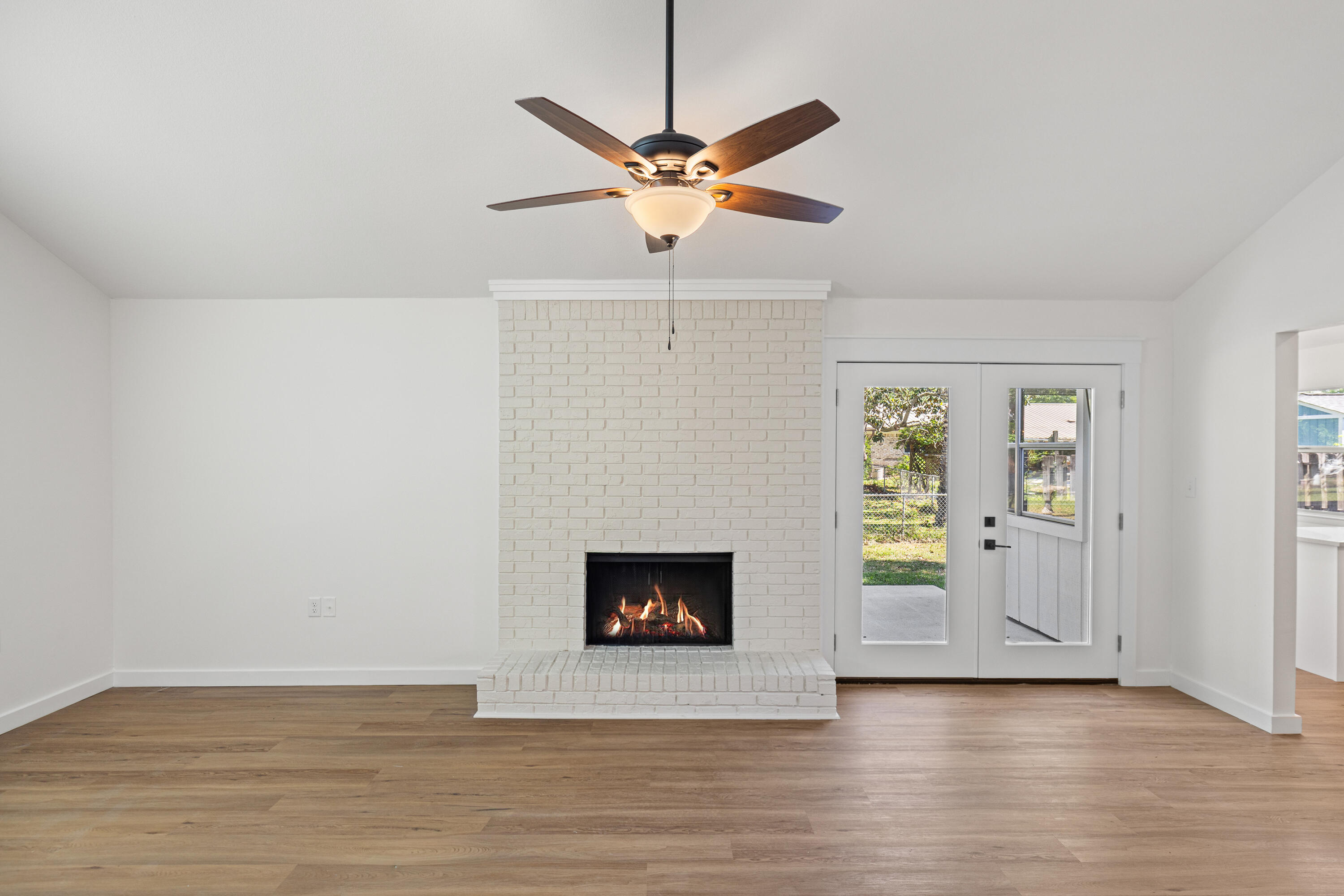 103 Perdido Circle Niceville, FL 32578 - Photo 10 of 71 a view of a livingroom with a fireplace and wooden floor