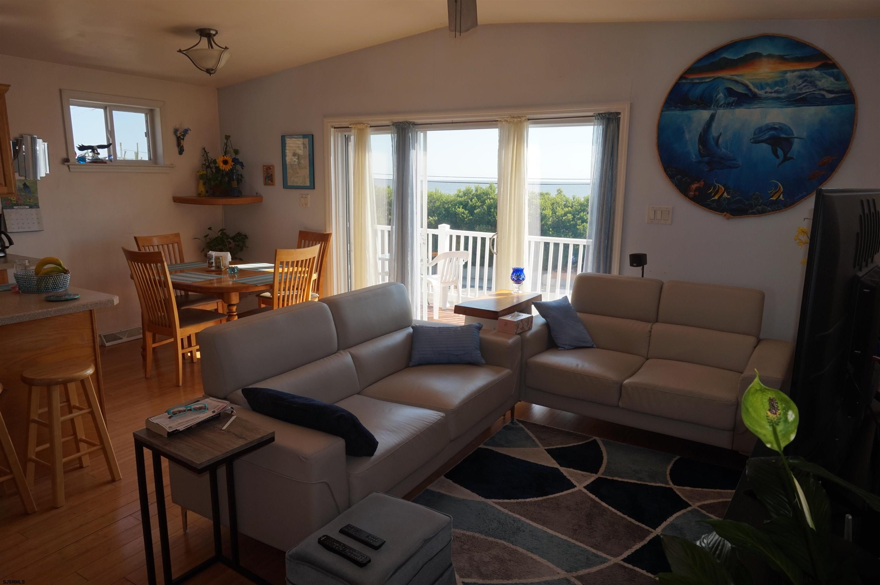 77 Delaware Avenue Fortescue, NJ 08321 - Photo 12 of 47 a living room with furniture and a window