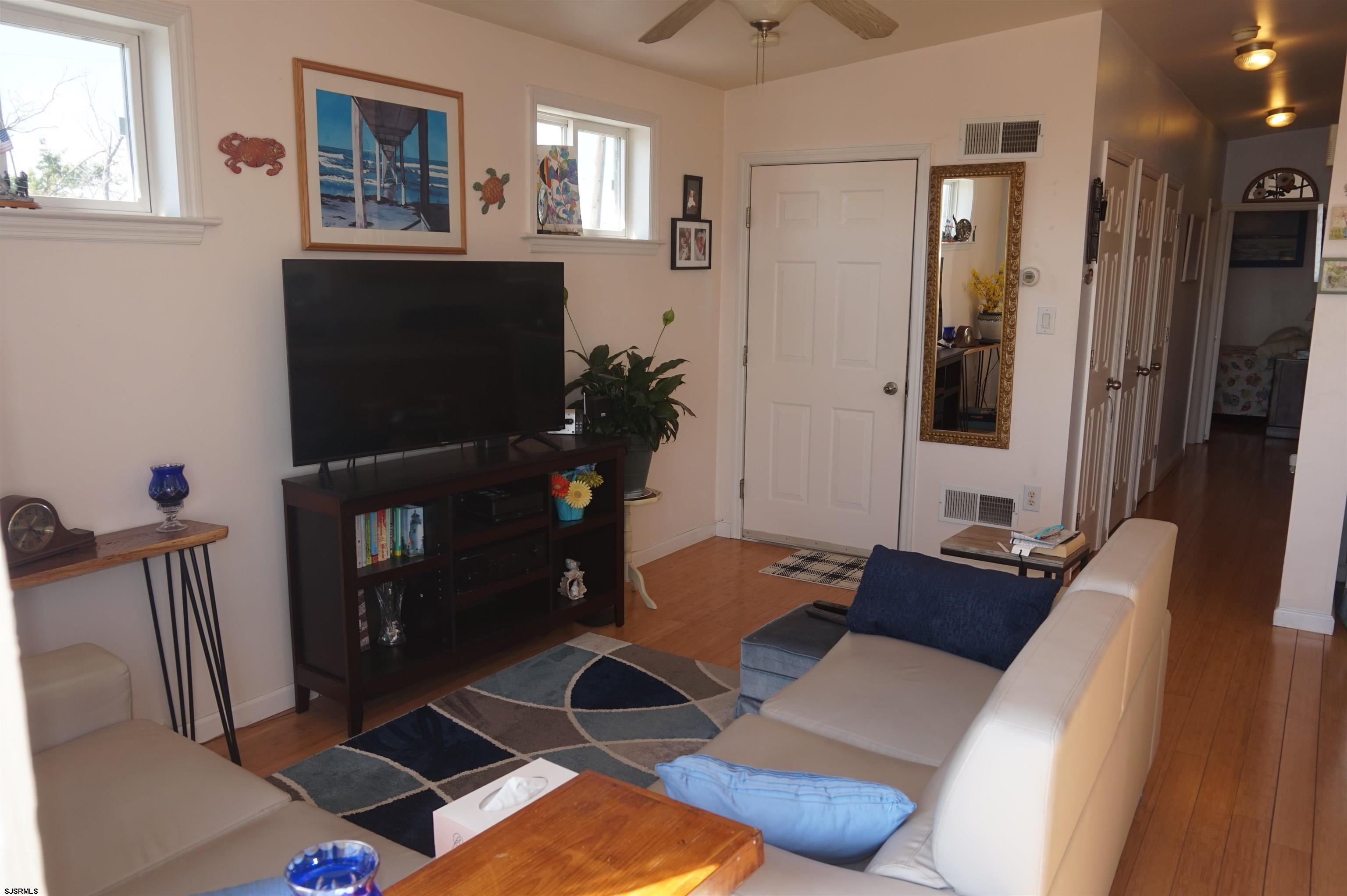 77 Delaware Avenue Fortescue, NJ 08321 - Photo 13 of 47 a living room with furniture and a flat screen tv