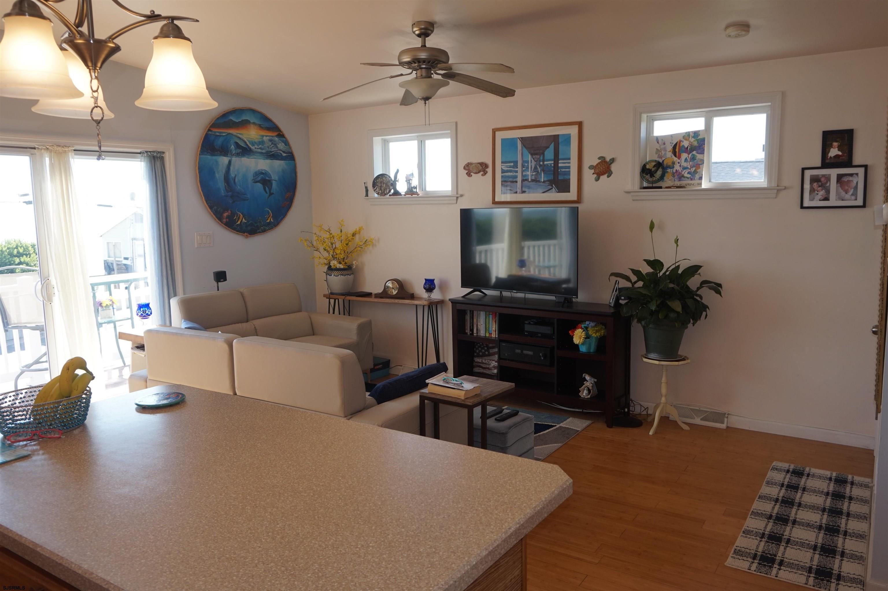 77 Delaware Avenue Fortescue, NJ 08321 - Photo 14 of 47 a living room with furniture a mirror and a table