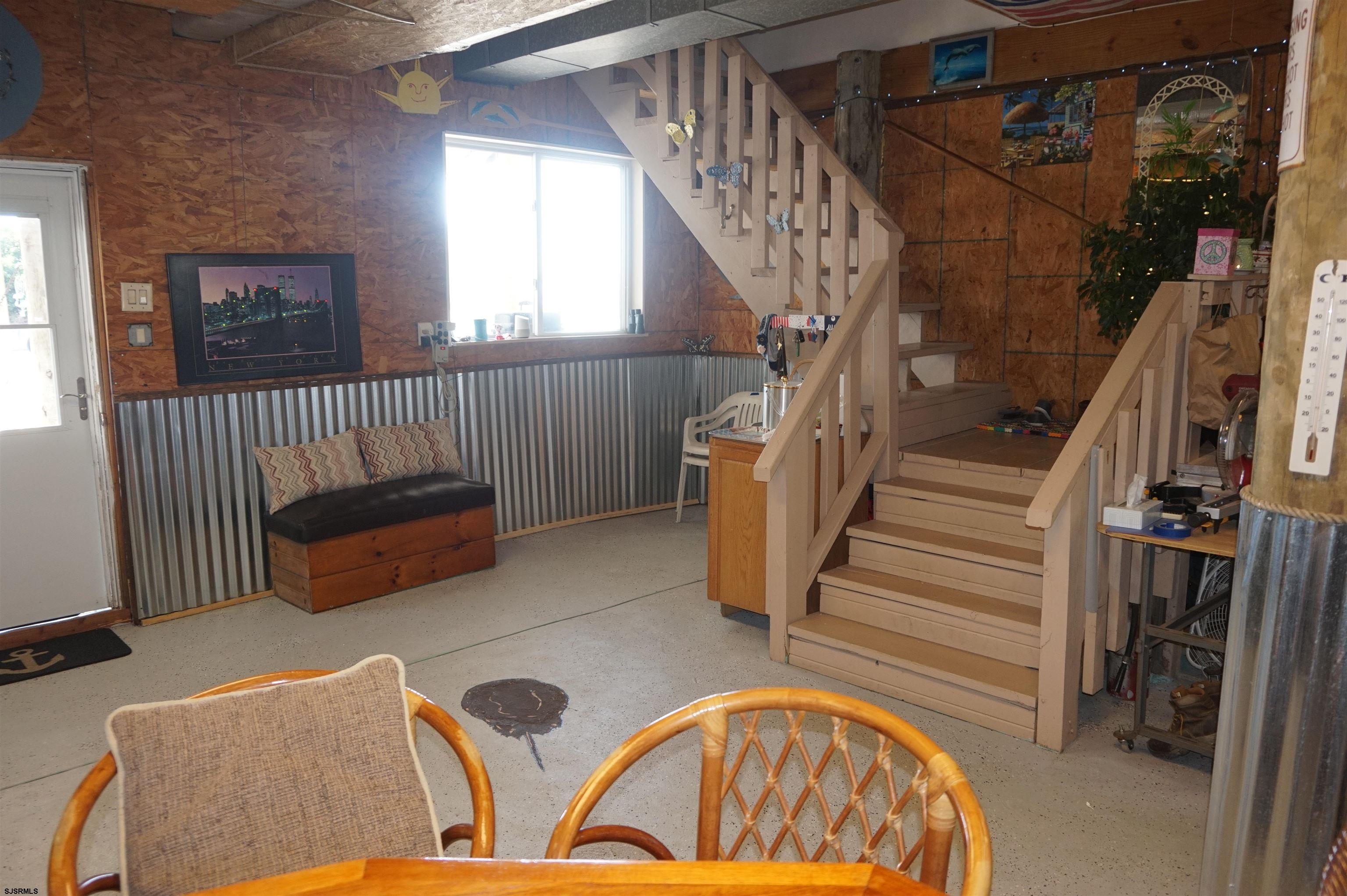 77 Delaware Avenue Fortescue, NJ 08321 - Photo 22 of 47 a view of livingroom with furniture and staircase
