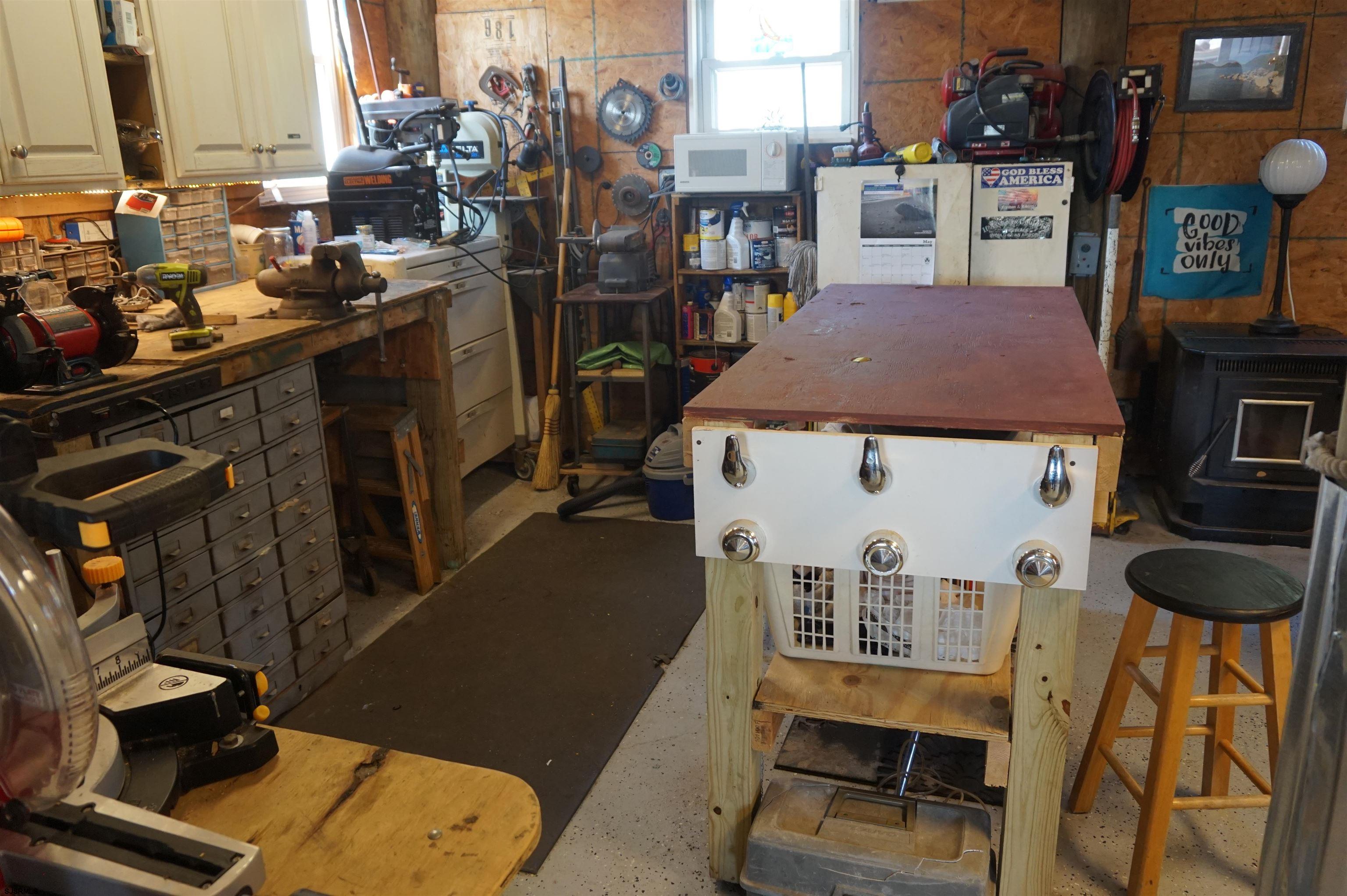 77 Delaware Avenue Fortescue, NJ 08321 - Photo 28 of 47 a room with furniture a flat screen tv and a table