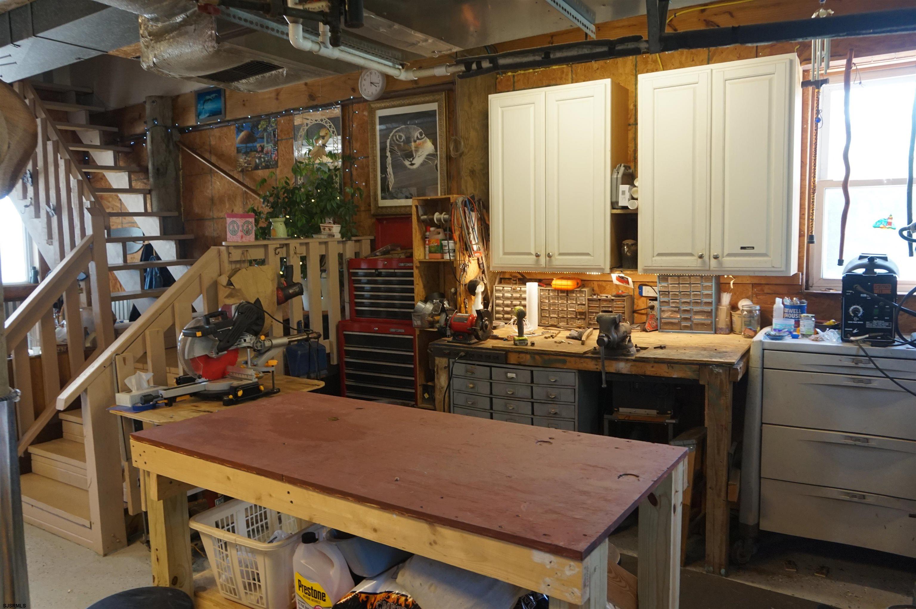 77 Delaware Avenue Fortescue, NJ 08321 - Photo 30 of 47 a kitchen that has a table and chairs in it