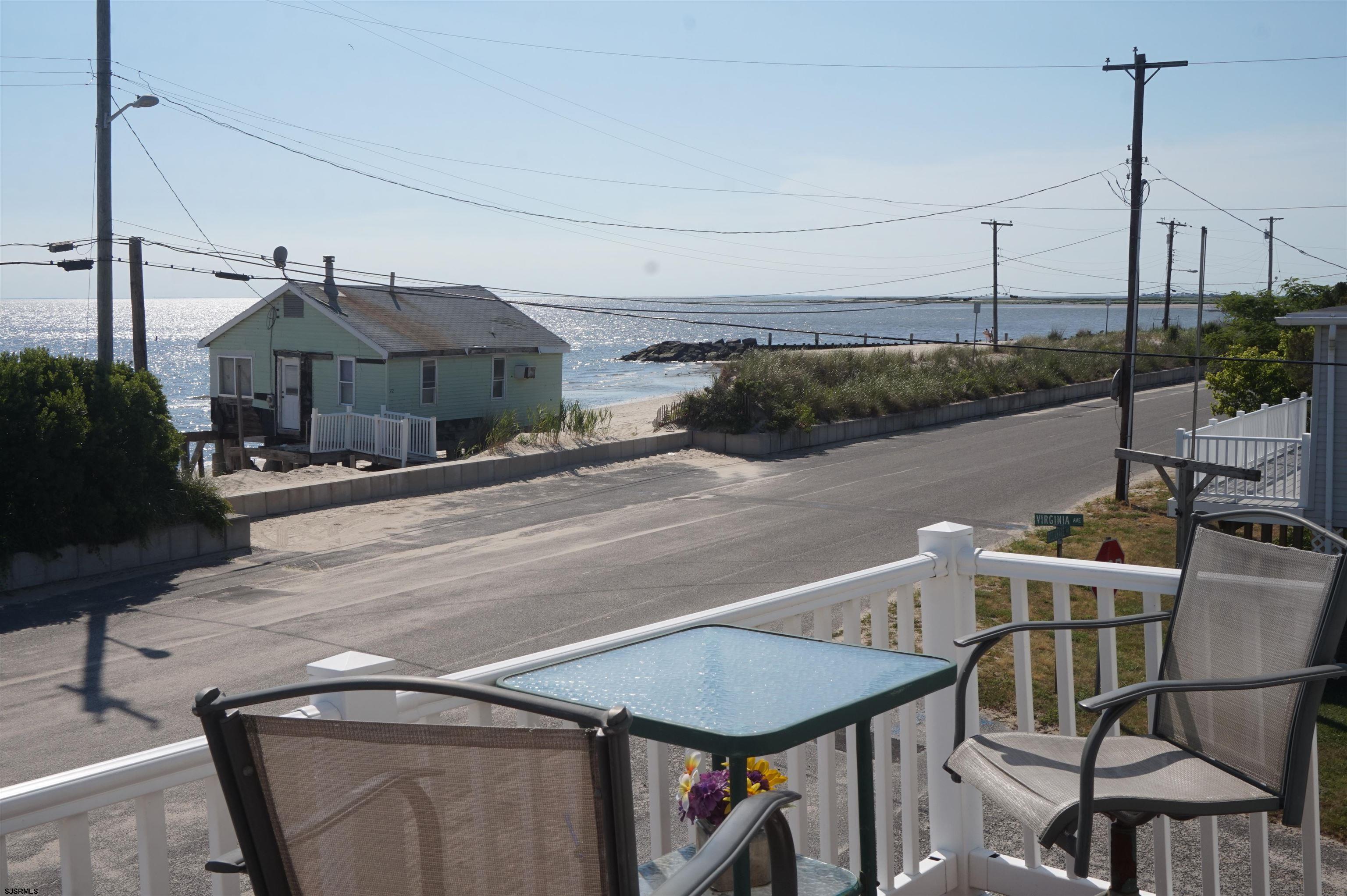 77 Delaware Avenue Fortescue, NJ 08321 - Photo 34 of 47 a terrace with a table and chairs