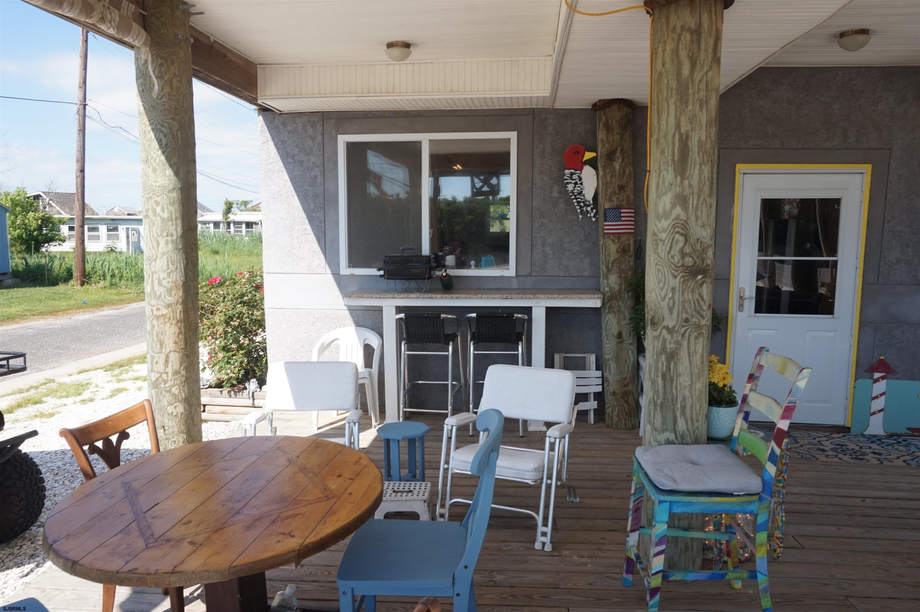 77 Delaware Avenue Fortescue, NJ 08321 - Photo 39 of 47 a view of a dining room with furniture window and wooden floor