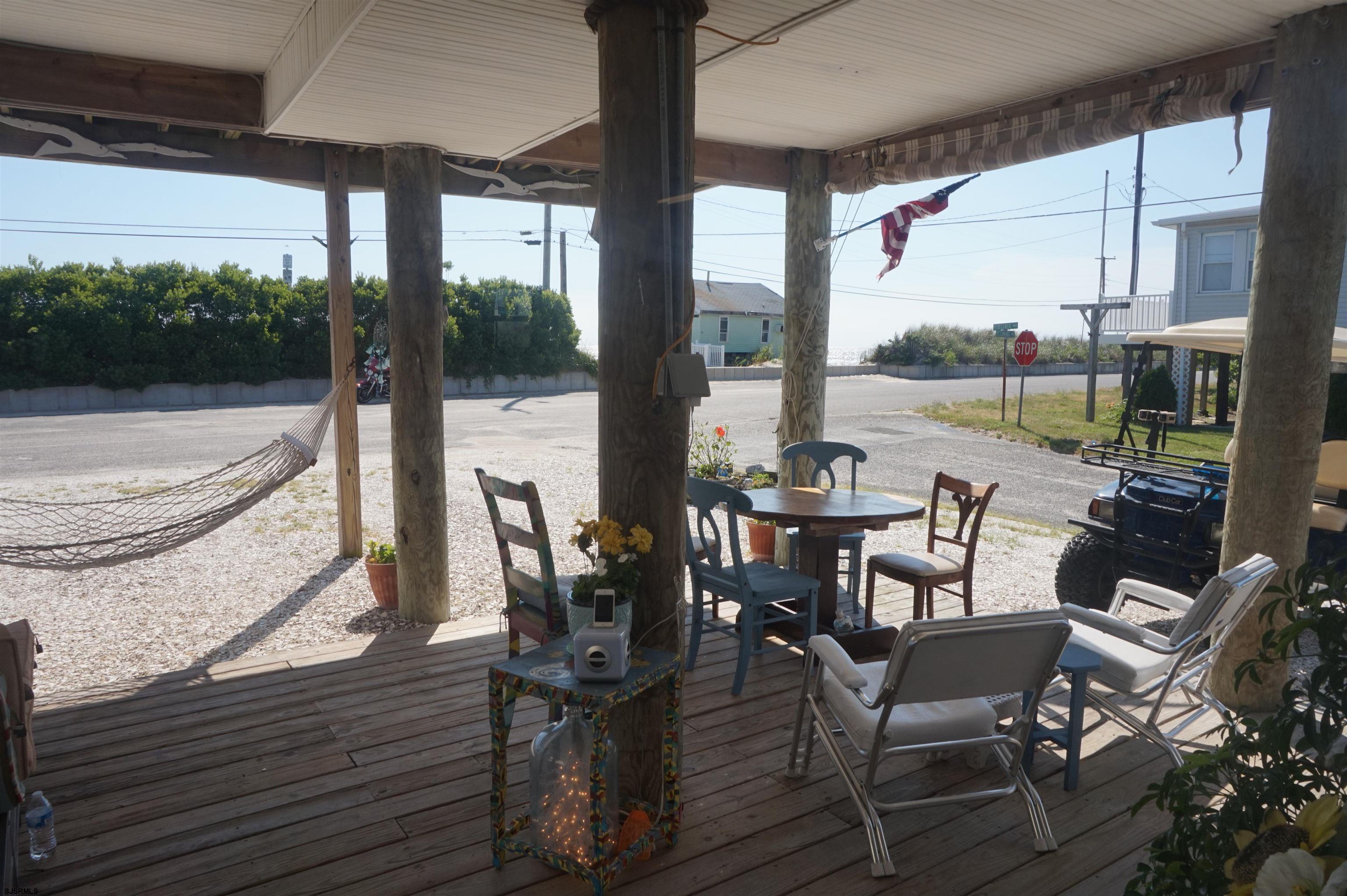 77 Delaware Avenue Fortescue, NJ 08321 - Photo 4 of 47 a dining room with furniture and a floor to ceiling window