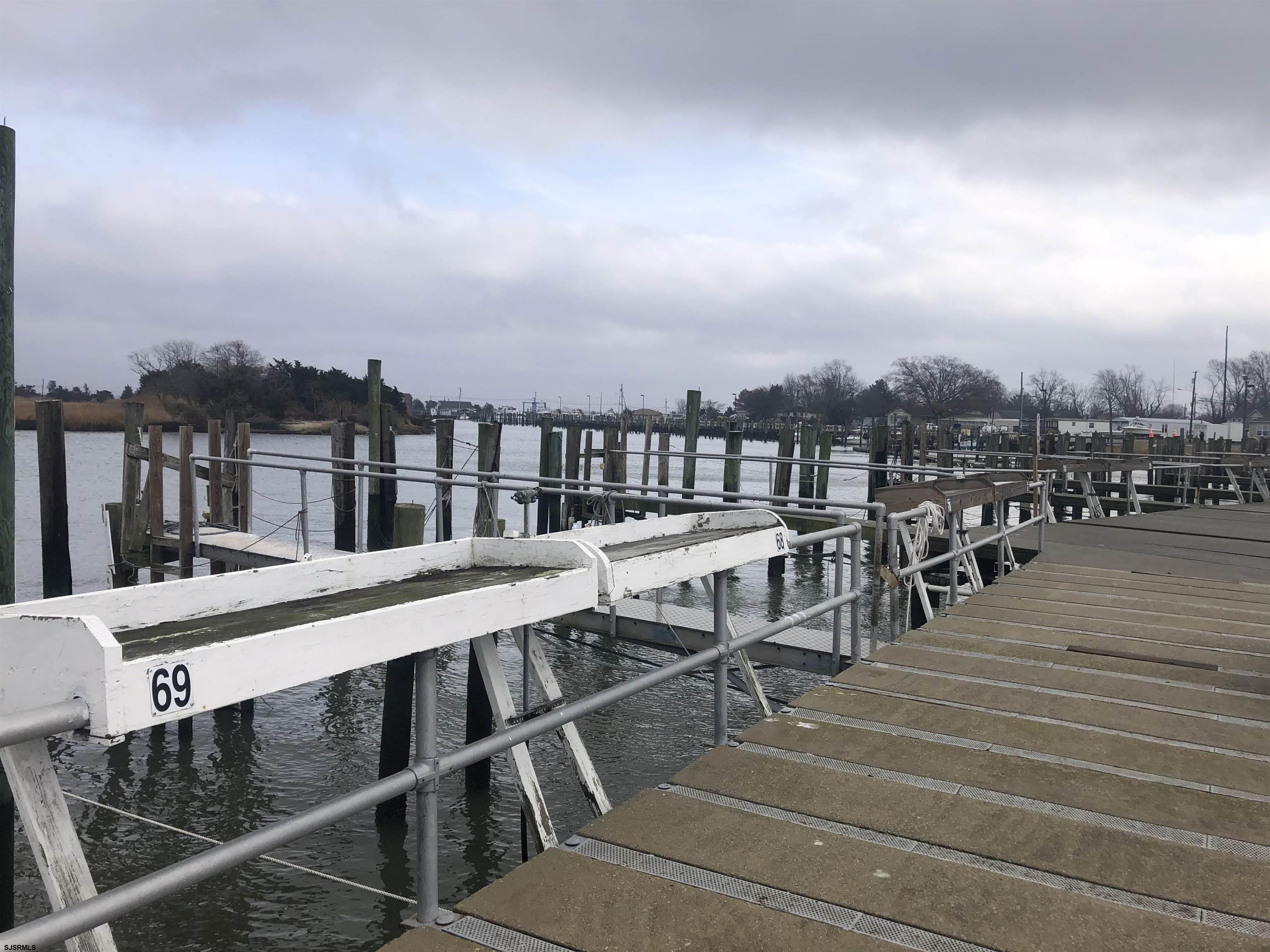77 Delaware Avenue Fortescue, NJ 08321 - Photo 42 of 47 a view of a chairs and table on the terrace
