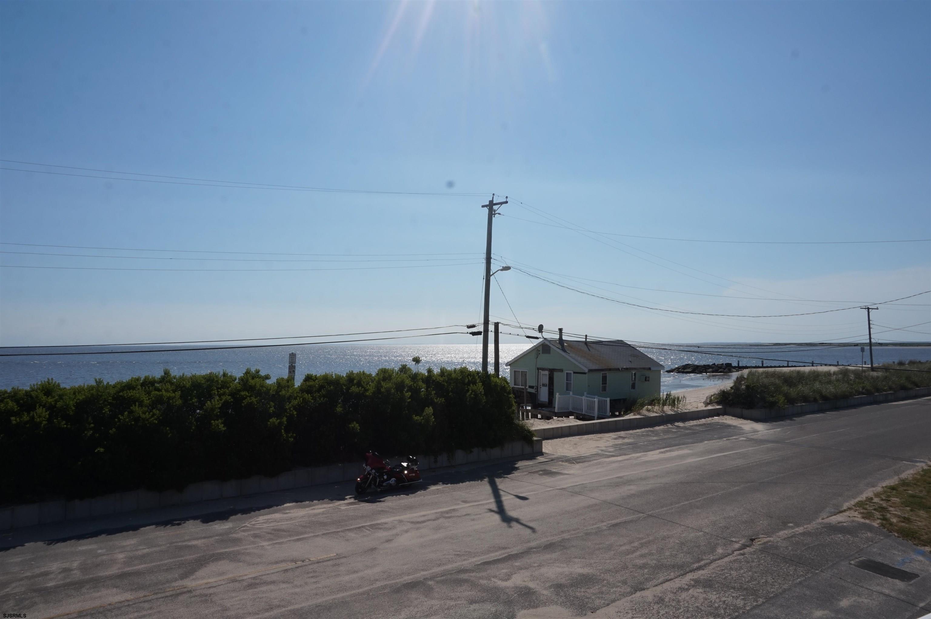 77 Delaware Avenue Fortescue, NJ 08321 - Photo 5 of 47 a car parked on the side of the road