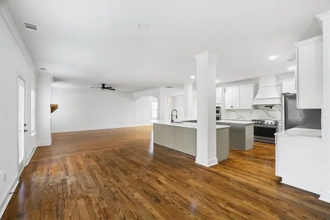 a living room with furniture and a rug