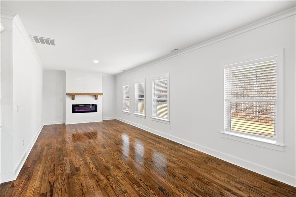 222 Silvercrest Drive Acworth, GA 30101 - Photo 17 of 73 a view of an empty room with a window and wooden floor