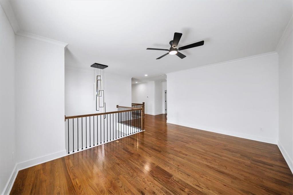 222 Silvercrest Drive Acworth, GA 30101 - Photo 22 of 73 a view of a room with wooden floor and ceiling fan