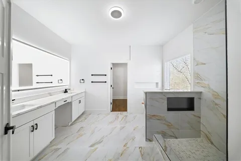 a bathroom with a bathtub and a toilet