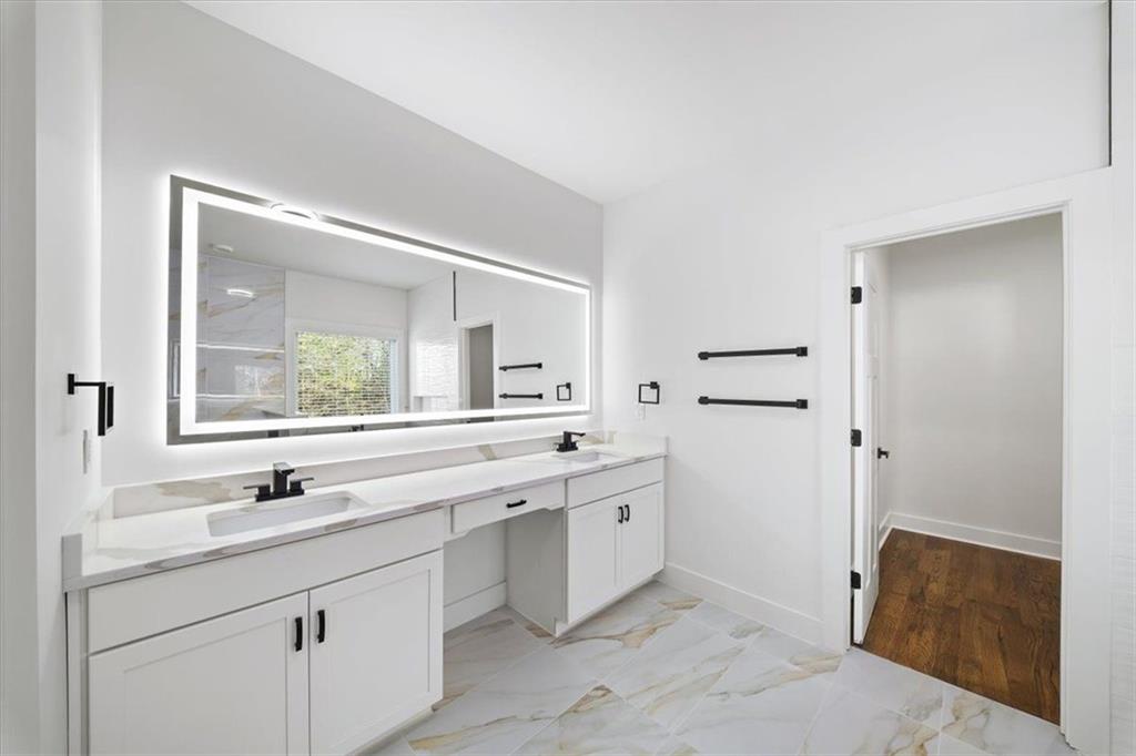222 Silvercrest Drive Acworth, GA 30101 - Photo 24 of 73 a bathroom with a double vanity sink and mirror with bathtub