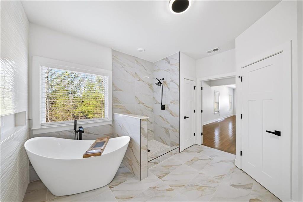 222 Silvercrest Drive Acworth, GA 30101 - Photo 24 of 61 a bathroom with a sink bathtub and shower