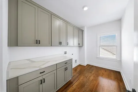 a view of a livingroom with wooden floor
